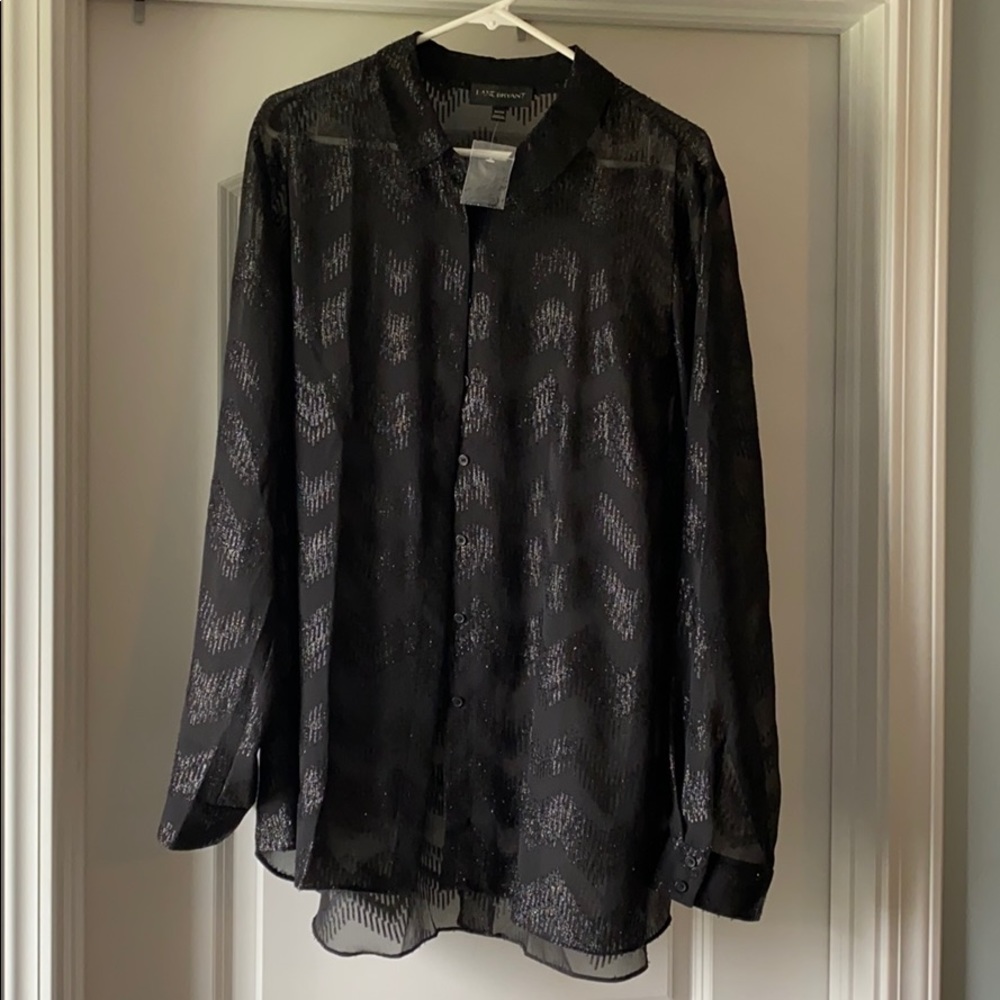 Sheer black blouse with bottom slit in the back.